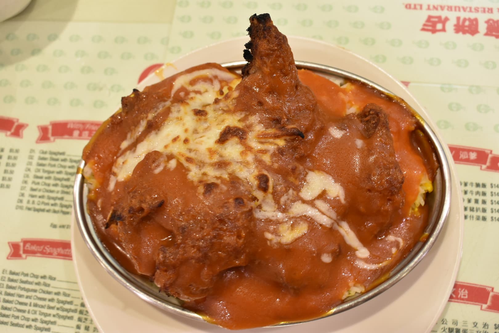Baked porkchop on rice. Photo by Anastasia Bosc.